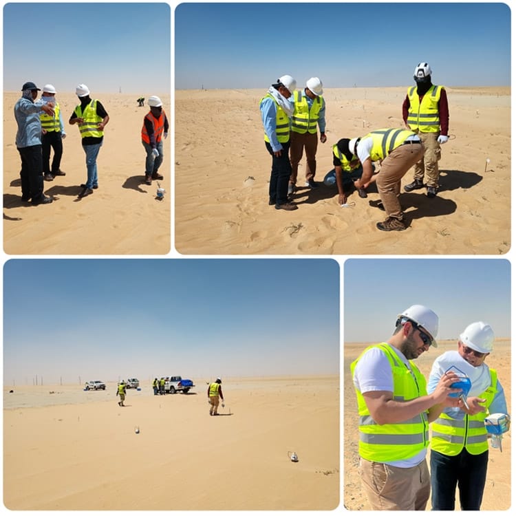 Geophysical exploration team deploying SmartSolo nodes for seismic survey in a desert environment.