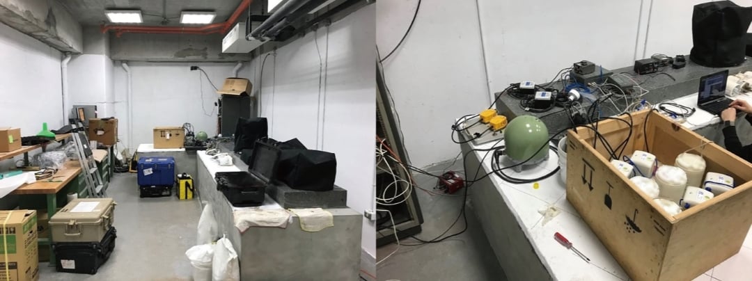 A lab with SmartSolo seismometer nodes in a wooden crate and other seismic instruments for earthquake monitoring.