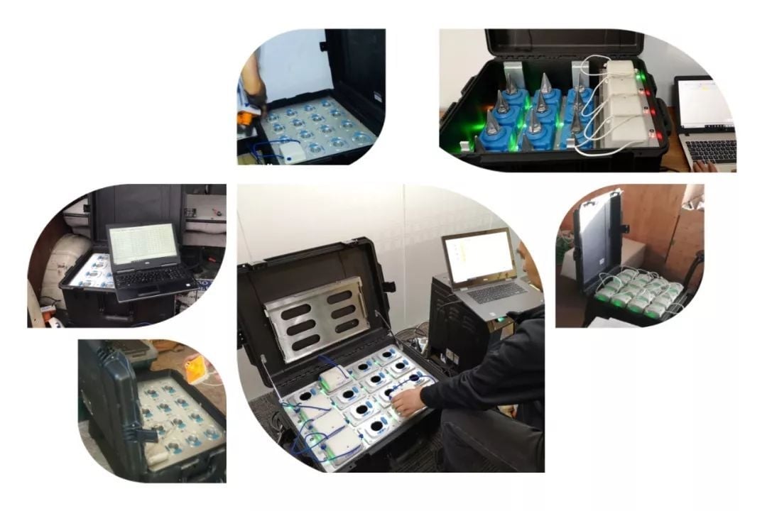 SmartSolo nodes and seismometers in cases with laptops for seismic survey and earthquake monitoring.