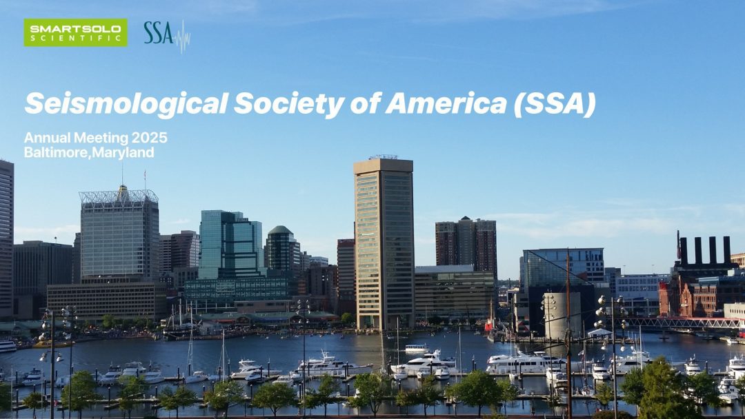 SmartSolo Scientific and SSA logos above text "Seismological Society of America (SSA) Annual Meeting 2025 Baltimore, Maryland" over a cityscape with a harbor and boats.